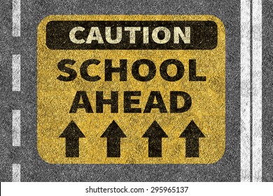 Asphalt Road With School Ahead Caution Sign