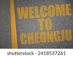 asphalt road with text welcome to cheongju near yellow line. concept