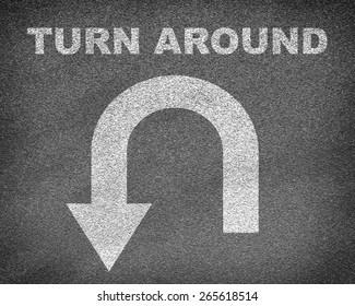 Asphalt Road Texture With U-turn Sign And Text Turn Around. Business Concept