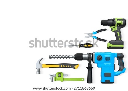 Assorted hand and power tools including drill, hammer, and pliers isolated on white background with clipping path. Concept of repair and construction