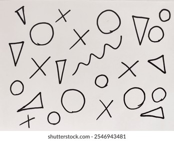 An assortment of bold black geometric shapes scattered across a white background captures a playful yet minimalist artistic style. - Powered by Shutterstock