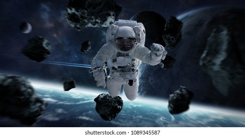 Astronaut floating in space in front of planets 3D rendering elements of this image furnished by NASA