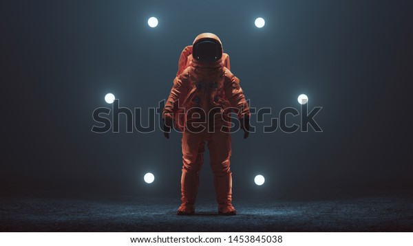 Astronaut in an Orange Space\
Suit with Black Visor Standing in a Alien Void 3d illustration 3d\
render