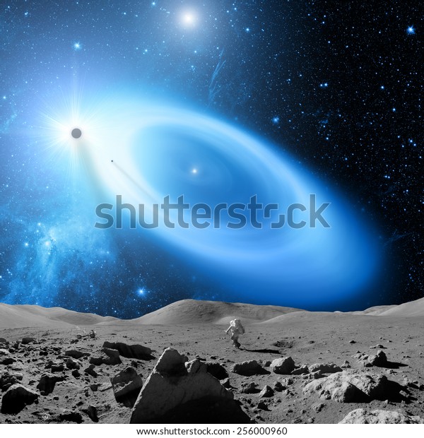 Astronaut as\
seen from the Moon-like surface planet in a distant galaxy.\
Elements of this image furnished by\
NASA.