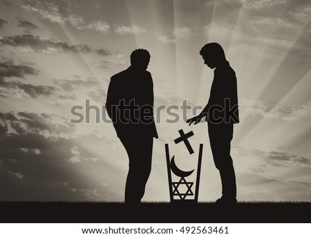 Atheism concept. Man atheist silhouette throws all religions in the trash at sunset