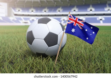 Australian flag in stadium field with soccer football
