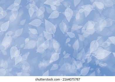 A Baby Blue Gradient Based Bokeh Glitter Image With A Theme Of Falling Leaves On A Blurred Background. Ideal For Advising Design, Card, Wallpaper  Etc.,