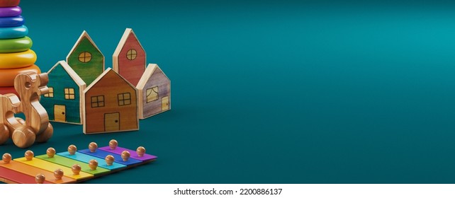 Baby Kids Toys Banner Background. Top View To Colorful Educational Wooden Toys On Blue Background. Early Education, Zero Waste, Montessori Toys For Children. 3d Rendering. 3D Illustration