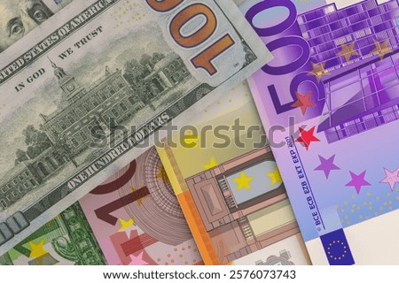 Back side of US 100 dollar bill with European currency banknotes - Euro. Foreign exchange market. Financial concept