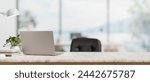 A back view image of a laptop computer on a white marble desk in a modern spacious office. workspace concept. 3d render, 3d illustration