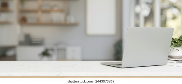 A back view image of a laptop computer on a white tabletop in a contemporary office. workspace concept. 3d render, 3d illustration