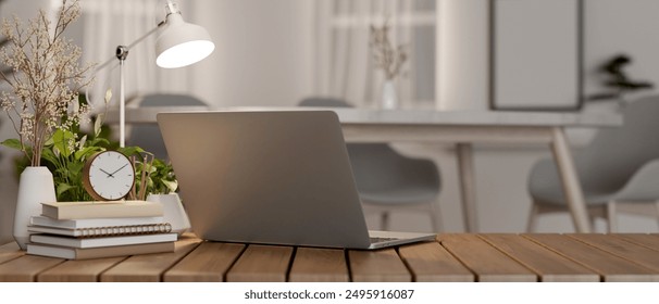 A back view image of a laptop computer, books, an alarm, decor plants, and a table lamp on a wooden table in a minimalist room. workspace, place of work, 3d render, 3d illustration