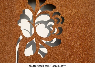Background corten steel with laser cut in form of a flower