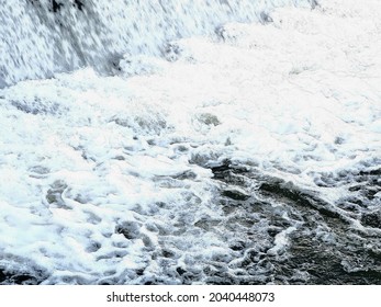 Background Illustration Of White Wave Bubbles Breaking Under The Dam 