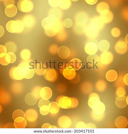 A background of light blur or bokeh effect in orange and gold.