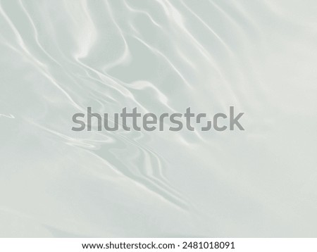 The​ metal​ texture​ of​ surface​ blue​ water​ reflected​ by​ sunlight​ for​ background. Blue​ water​ texture​ in​ deep​ sea​ for​ background. Reflection​ on​ surface​ blue​ water. Green​ water​.