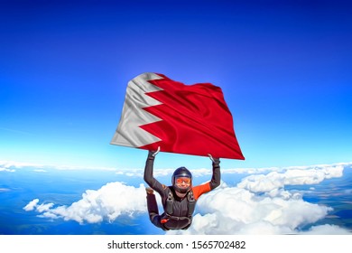 Bahrain Extreme. Flag In Skydiving. People In Free Fall Grab Flag Of Bahrain. Patriotism, Men And Flag.
