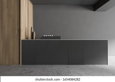 Bar counter in modern coffee shop with grey and wooden walls and concrete floor. Coffee machine with porcelain and paper cups. 3d rendering