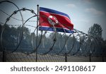 Barbed wire fence and flag of North Korea - 3d illustration