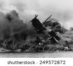 The battleship USS ARIZONA sinking after being hit by Japanese air attack on Dec. 7, 1941.