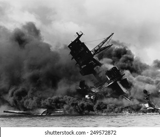 The Battleship USS ARIZONA Sinking After Being Hit By Japanese Air Attack On Dec. 7, 1941.