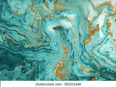 Beautiful abstract background. Golden and turquoise mixed acrylic paints. Marble texture. Contemporary art.