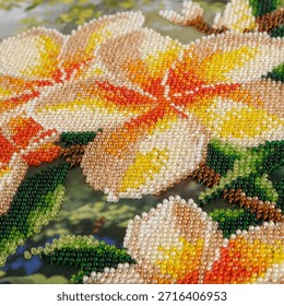 A beautiful example of home-based creative activity showing a beaded flower pattern. Perfect for DIY projects, art therapy, and handicraft inspiration themes.