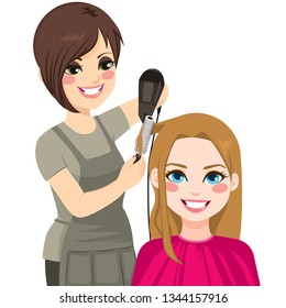 Beautiful hairdresser working drying and combing hair of customer woman - Powered by Shutterstock