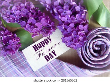 Beautiful purple lilac and tie for father's day. Greeting card. Abstract concept background for father's day celebration.  - Powered by Shutterstock