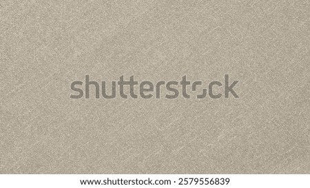 Beige background with a linen texture. The background is soft and neutral, featuring a subtle beige color twice for a calming effect. Aesthetic beige desktop wallpaper with copy space.