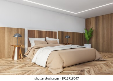 Beige And Wooden Bedroom, Bed With White Pillows And Beige Linens, Side View. Plant In The Corner And Lamps On Parquet Floor, 3D Rendering No People