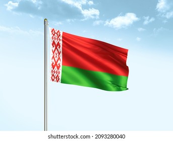 Belarus flag waving on blue sky background with clouds. Close up waving flag of Belarus. Belarus flag waving in the wind.