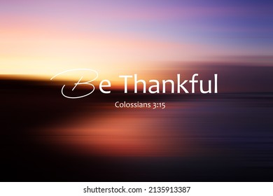 Bible Verse Inspirational Quote - Be Thankful. Colossians 3:15 On Colorful Abstract Background Illustration Of Blur Sunrise Sky Over The Sea. Grateful Christianity Words Concept.