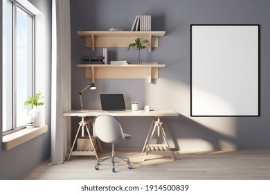 Big Blank White Poster In Black Frame In Home Cabinet With Cozy Workspace, Big Window, Wooden Furniture And Laptop. Mockup. 3D Rendering