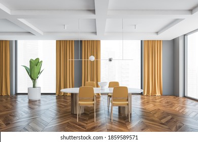 Big Living Room With Four Yellow Chairs And White Table. Large Windows In Big Hall With Yellow Curtains, Wooden Parquet Floor And Plant, Grey Walls, 3D Rendering No People