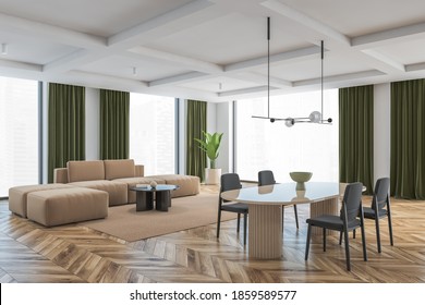 Big Living Room With Grey Chairs, Brown Table And Brown Sofa On Background. Large Windows In Big Hall With Green Curtains, Light Wooden Parquet Floor And White Walls, 3D Rendering No People