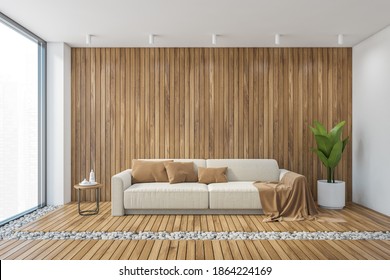 Big Wooden Living Room With Sofa And Wooden Floor, White Wall. Front View Of Modern White Couch With Brown Pillows, Plant In The Corner 3D Rendering, No People