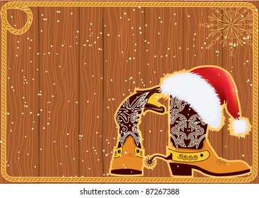 Billboard frame with cowboy boots and Santa's red hat on wood wall.Christmas background.Raster