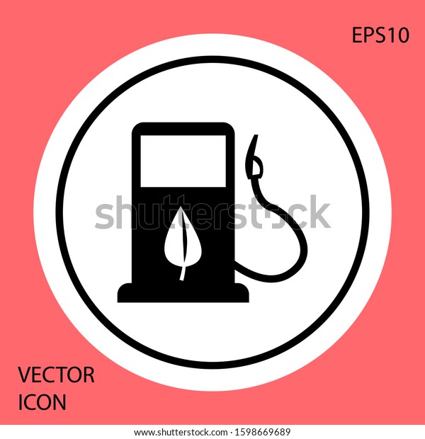Black Bio fuel concept with fueling nozzle and\
leaf icon isolated on red background. Gas station with leaves. Eco\
refueling. White circle button.\
