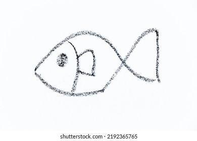 Black Color Crayon Hand Drawing In Fish Shape On White Paper Background