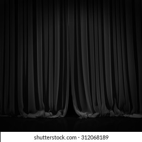 Black curtain with spot light on theater or cinema stage.