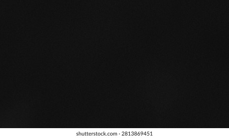 Black dark grainy texture background, subtle noise and faint speckled pattern on rough surface with minimal light and shadow gradient