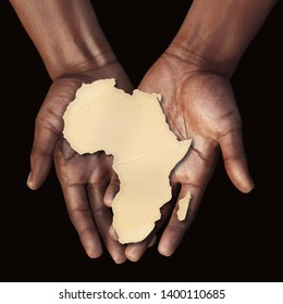 The black hands of an African man holding an African map in the palm of his hands, 3D illustration - Powered by Shutterstock