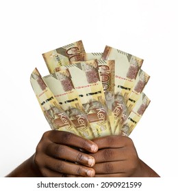 Black hands holding 3D rendered 1000 Kenyan shilling notes. closeup of Hands holding Kenyan currency notes
