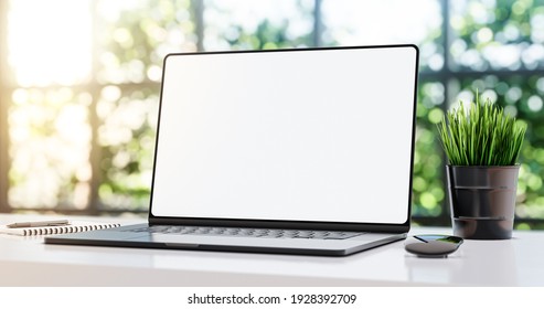 Black laptop with blank frameless screen mockup template on the table in industrial green ecological office loft interior - front view - 3d illustration