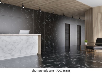 Black Marble And Dark Wooden Elevator Hall In An Office With A Reception Counter. There Are Two Black Doors In The Wall And A Brown Armchair. 3d Rendering Mock Up