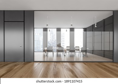 Black office conference room with parquet floor, black chairs and table. Meeting room behind glass windows, in modern office on parquet floor, 3D rendering no people