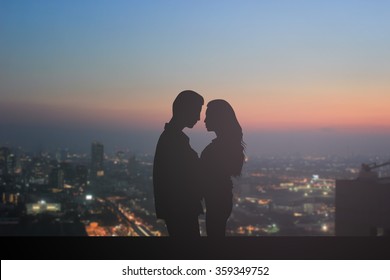 Black Silhouette Teen Couple Lover In Romance Moment On Blurred Night City Down Town Background For Love Story Movie Scene Cinema Concept.