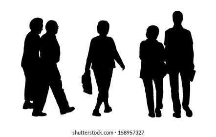 Black Silhouettes Of An Old Couple, Middle Age Woman And A Mixed Couple Walking In The Street