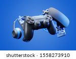 Black standard videogame controller, headphones and game console on a blue gradient background. 3d rendering.